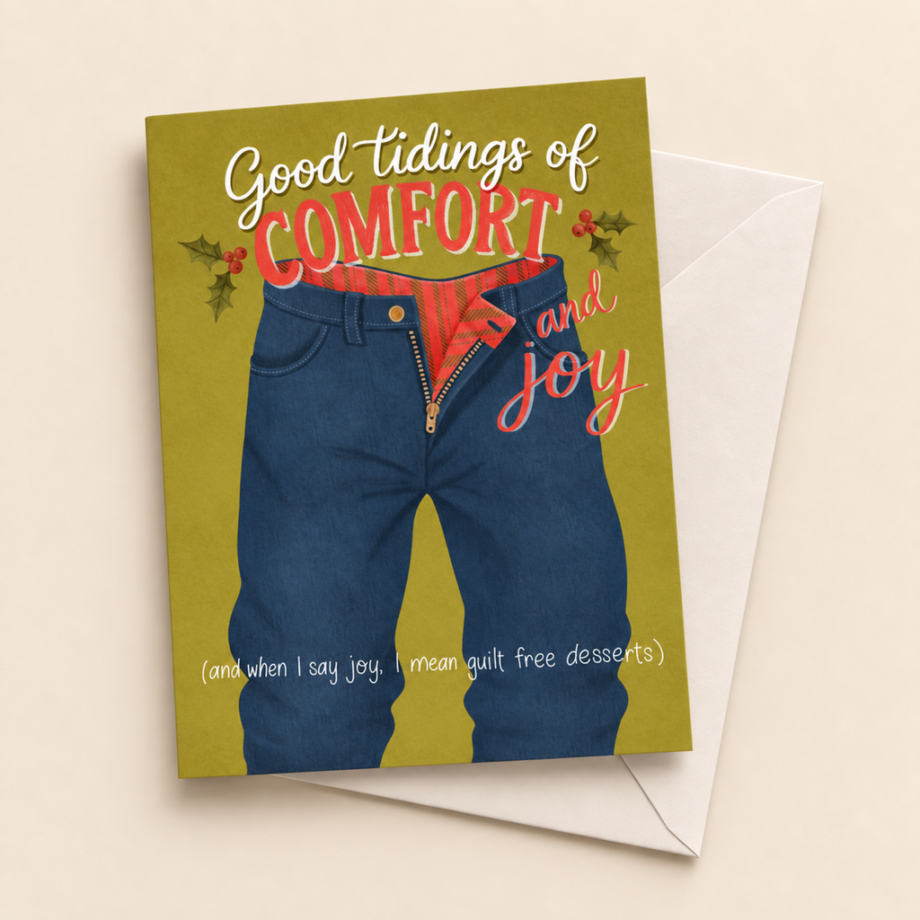 Comfort and Joy Christmas card with white envelope on a beige background